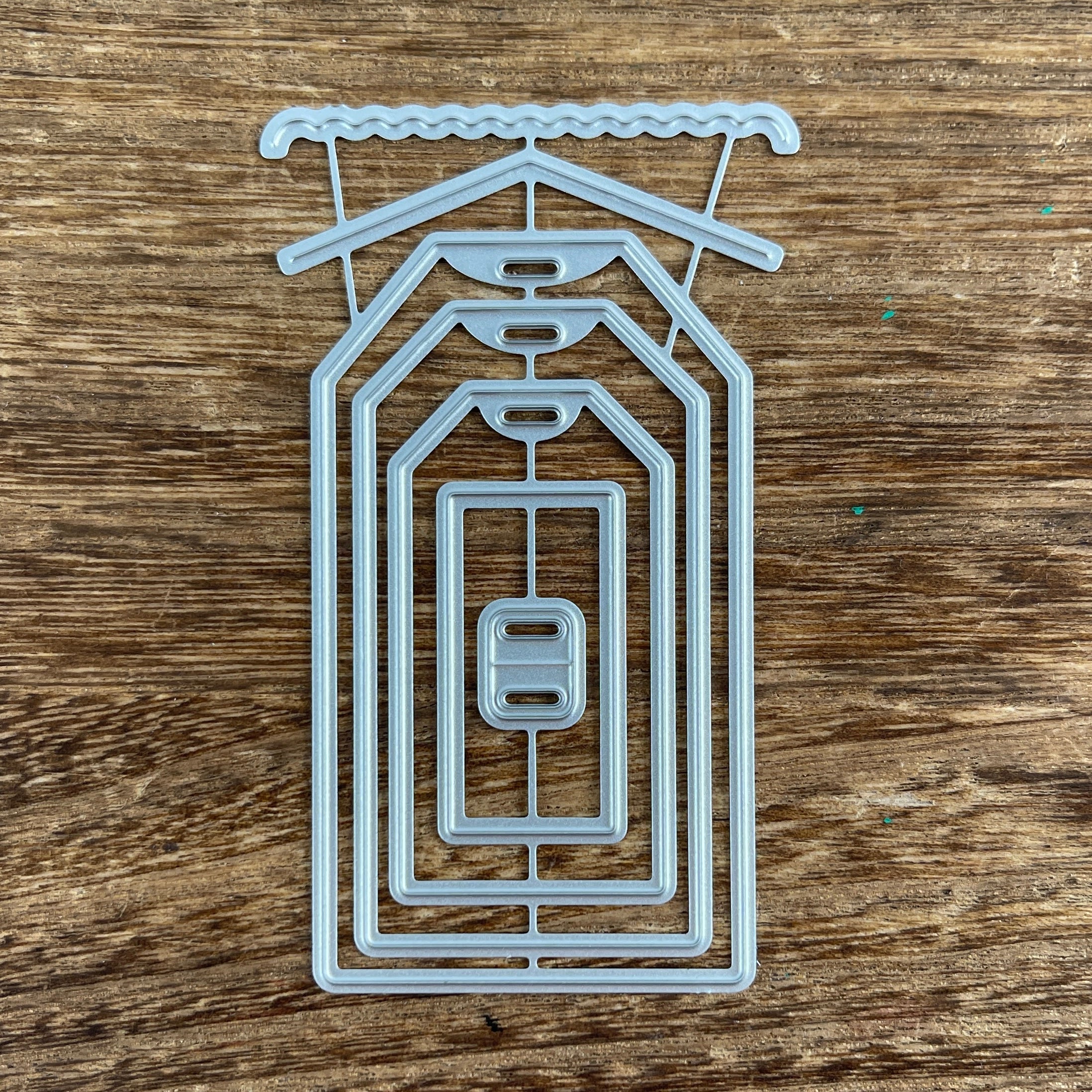 Tag cutting dies cut