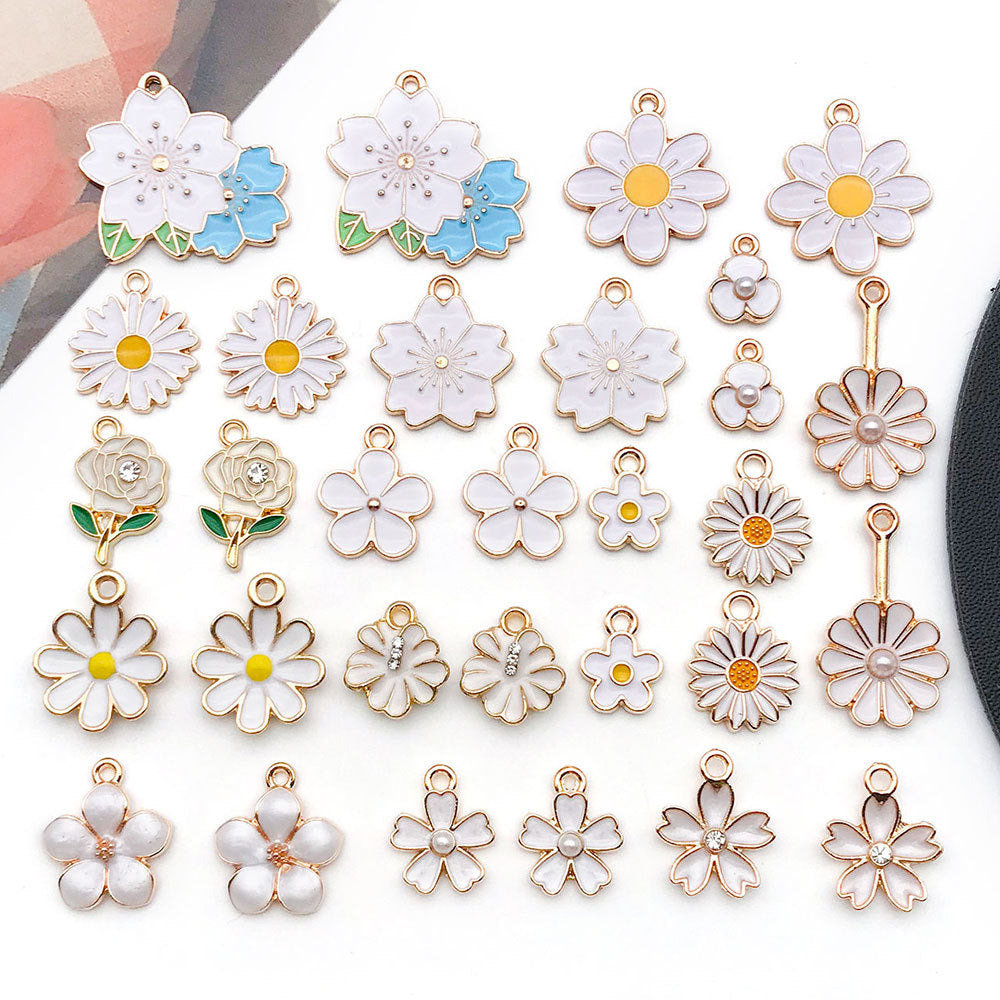 White flower charms in rows