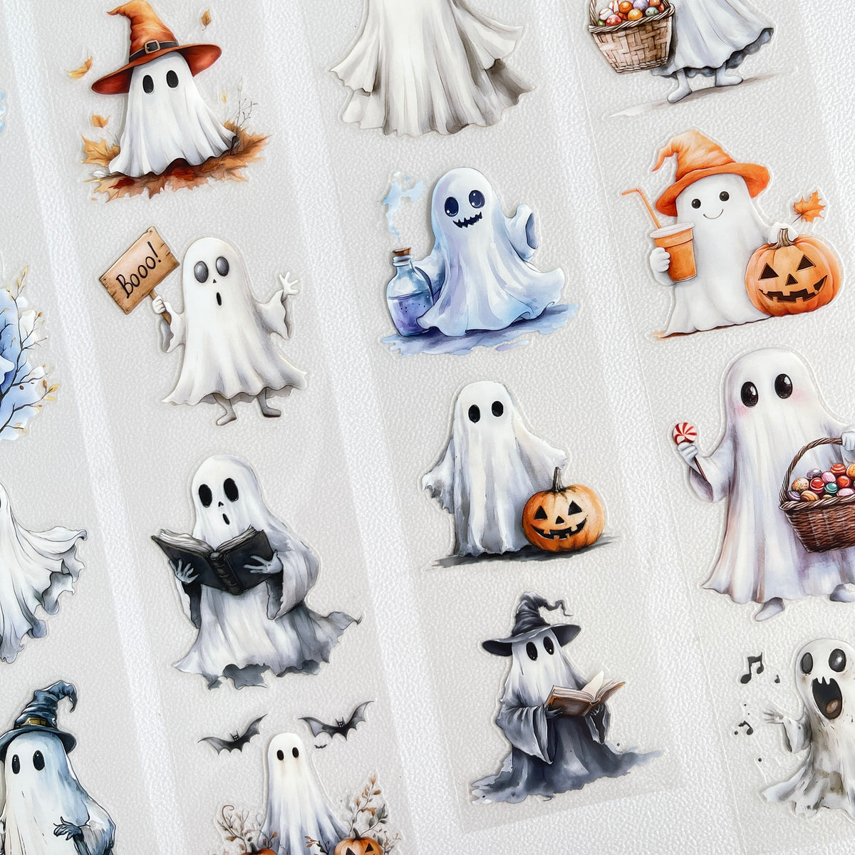 Ghosts with witch hats and pumpkins
