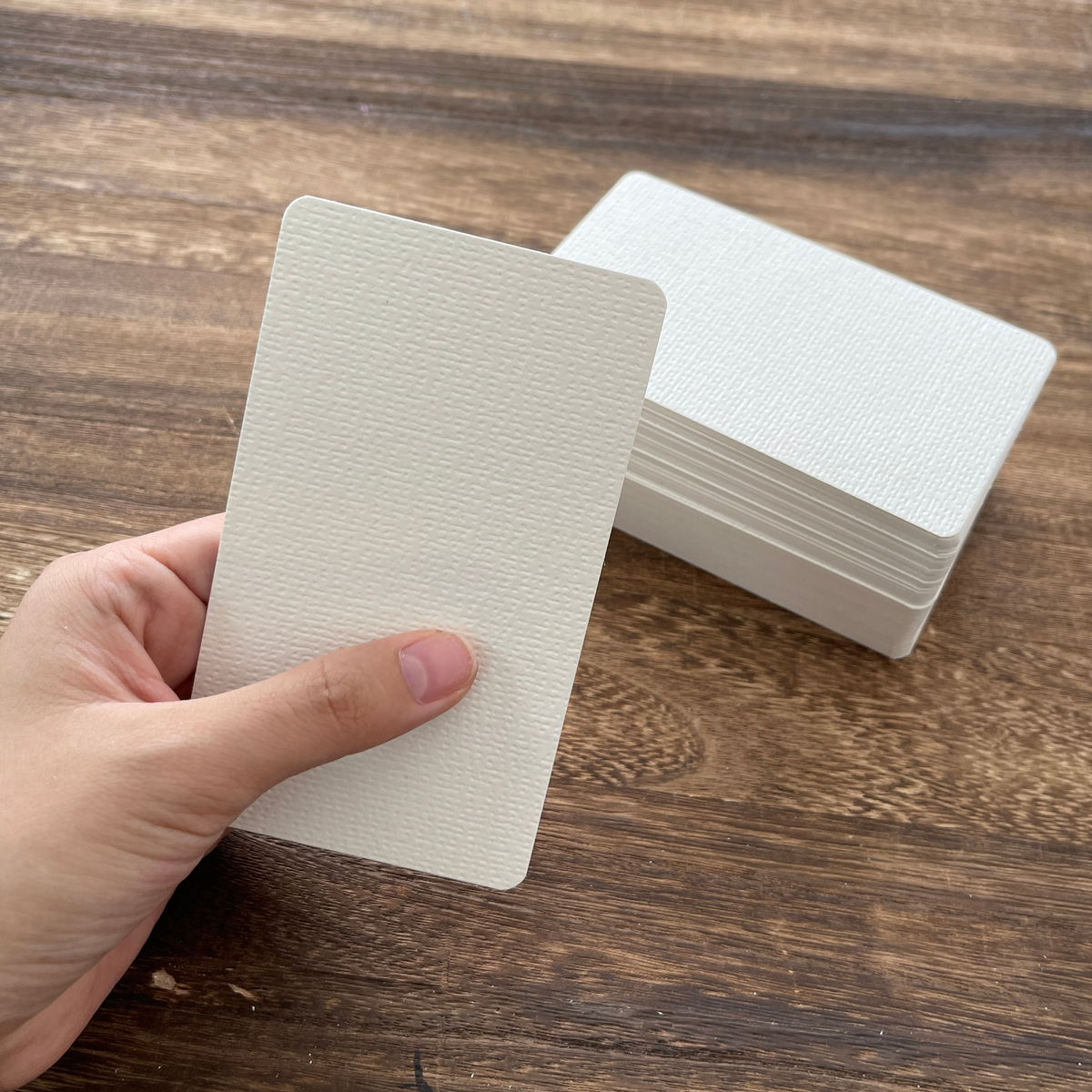 Holding a blank watercolor tarot card