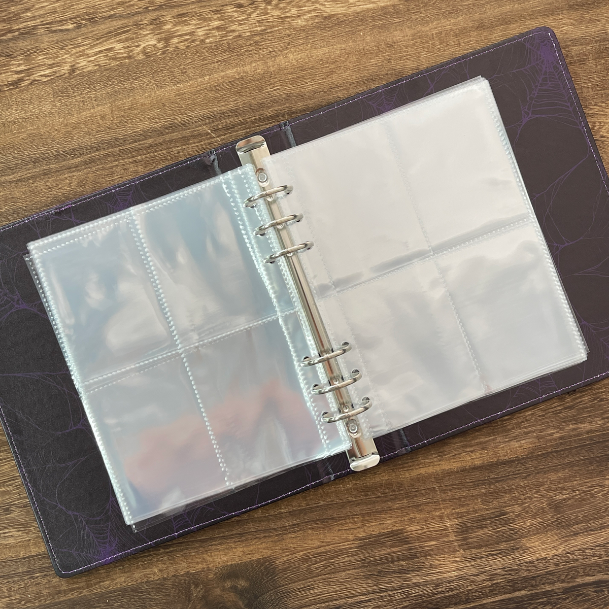 Open storage book with clear pocket pages
