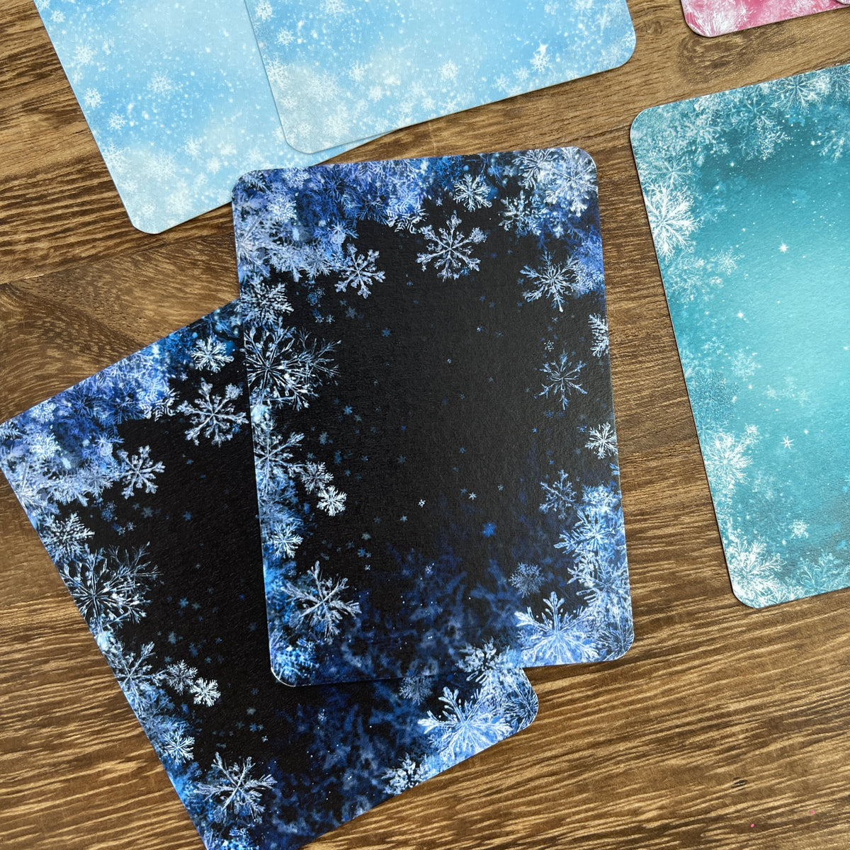 Close-up of blue and teal snowflake ATC cards