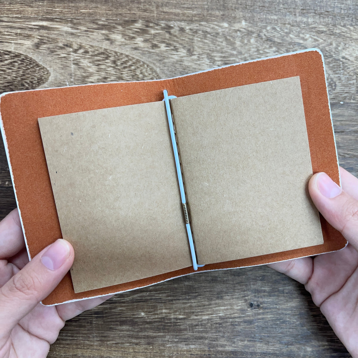 Notebook open with kraft pages
