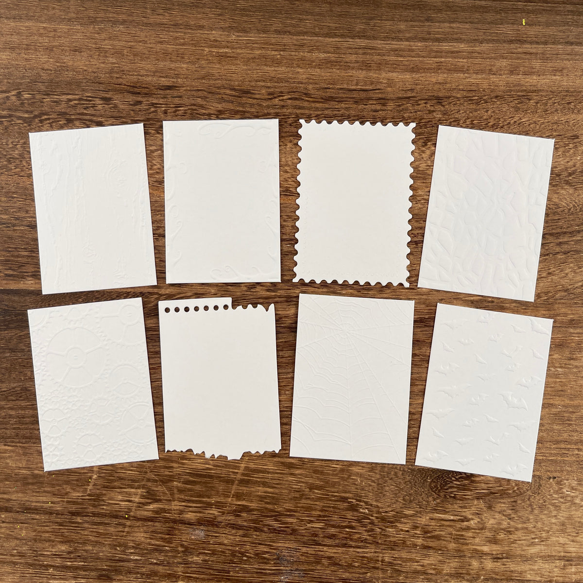 White embossed ATC cards with deckled edges