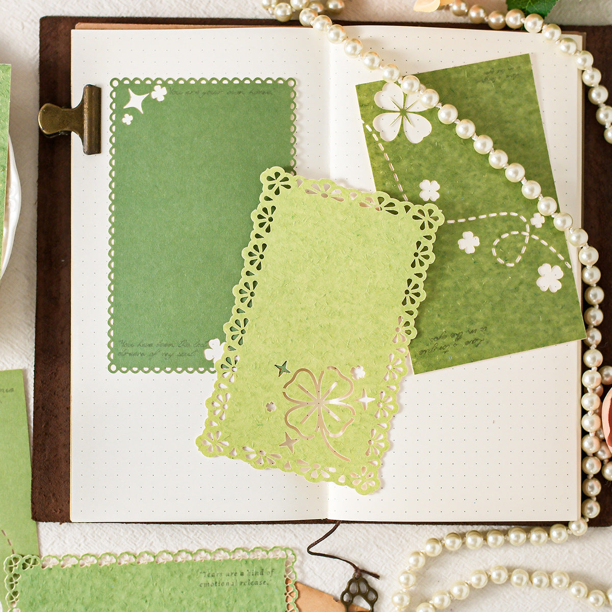 Green die-cut paper in journal