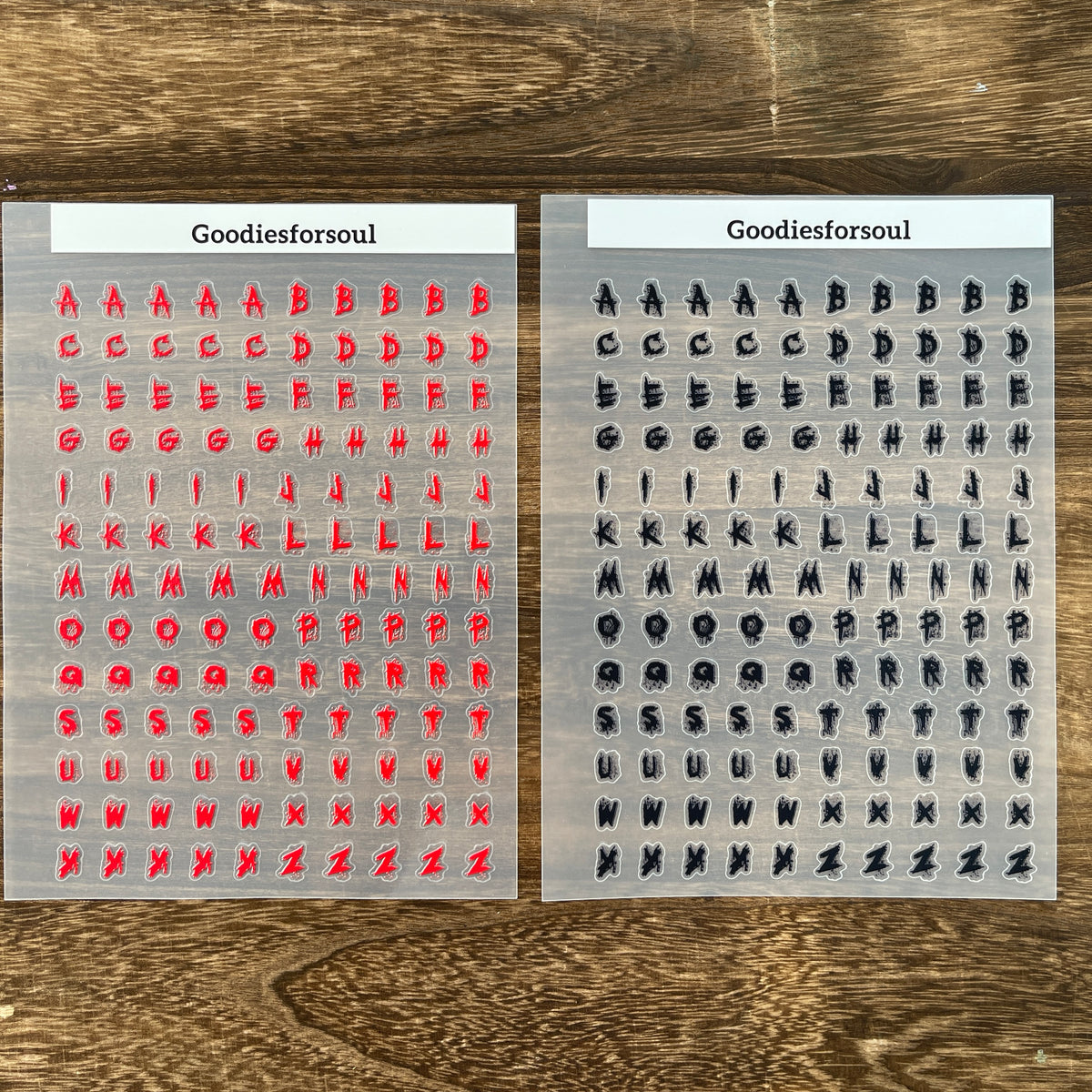 Red and black letter sheets side by side