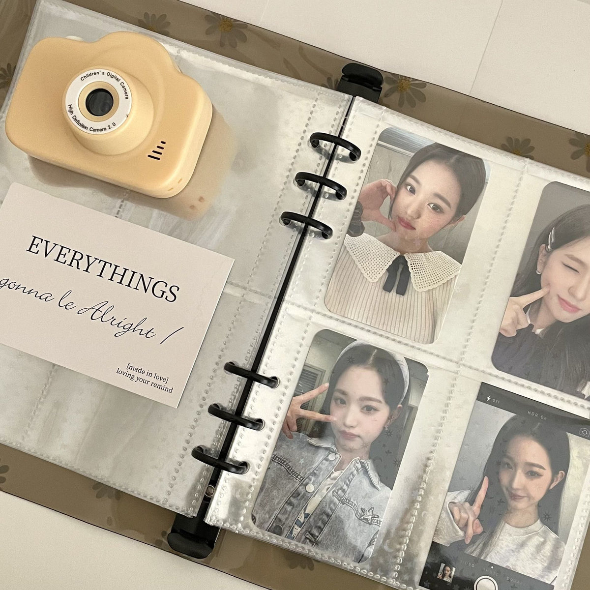 Binder open with photocards