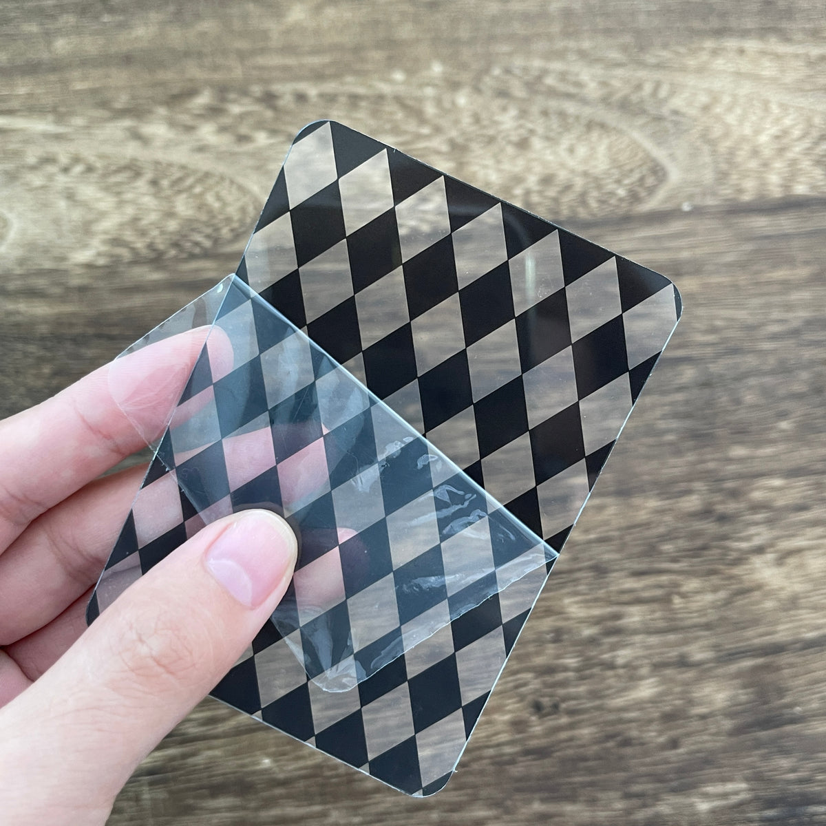 Holding a black harlequin clear card
