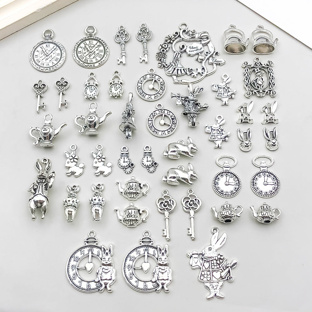 C-14- Silver Alice in wonderland mixed charms 44 psc